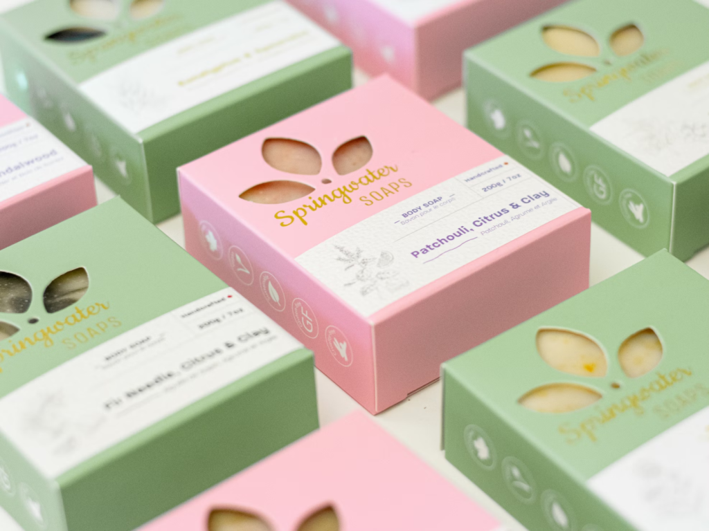A photo showing cardboard packaging containing soaps.