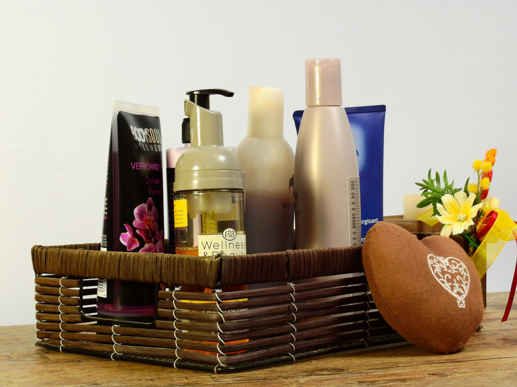 basket containing serum and moisturizer bottles and tubes