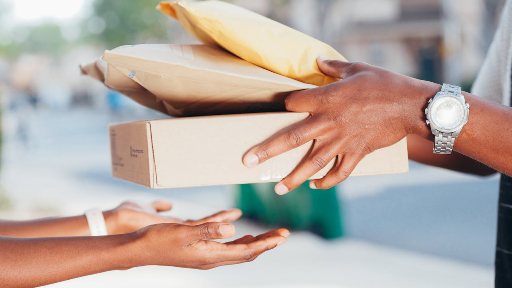 person-handing-over-packages