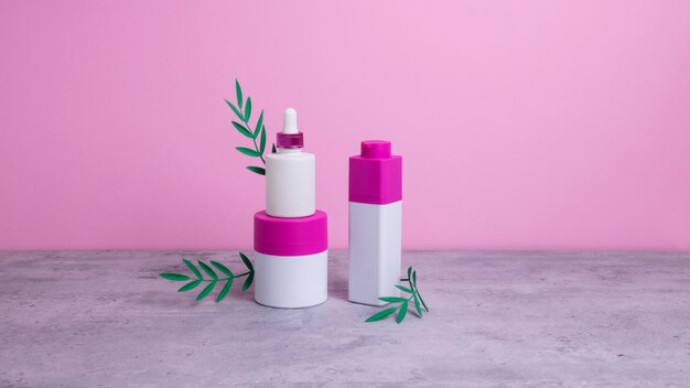 pink cosmetic bottles on a table