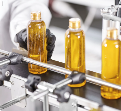 A production line filling up containers and bottles.