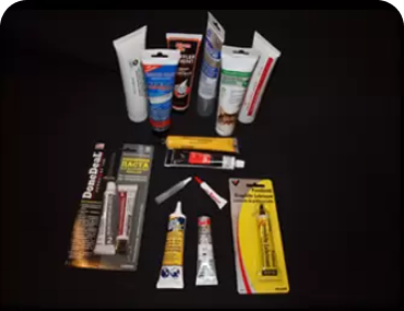 Several pieces of tubes laid out on a black background.