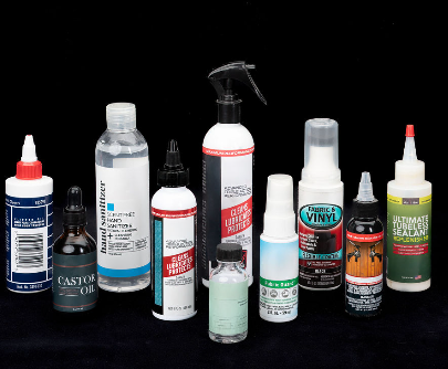 Several bottles filled on a black platform.