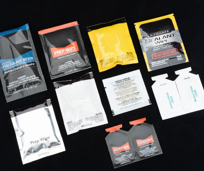 Several number of pouches laid out on a black platform.