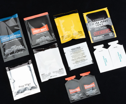 Several pouches laid out on a black background.
