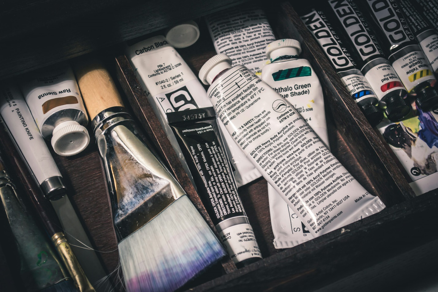 Several tubes filled with products, paints, and more.