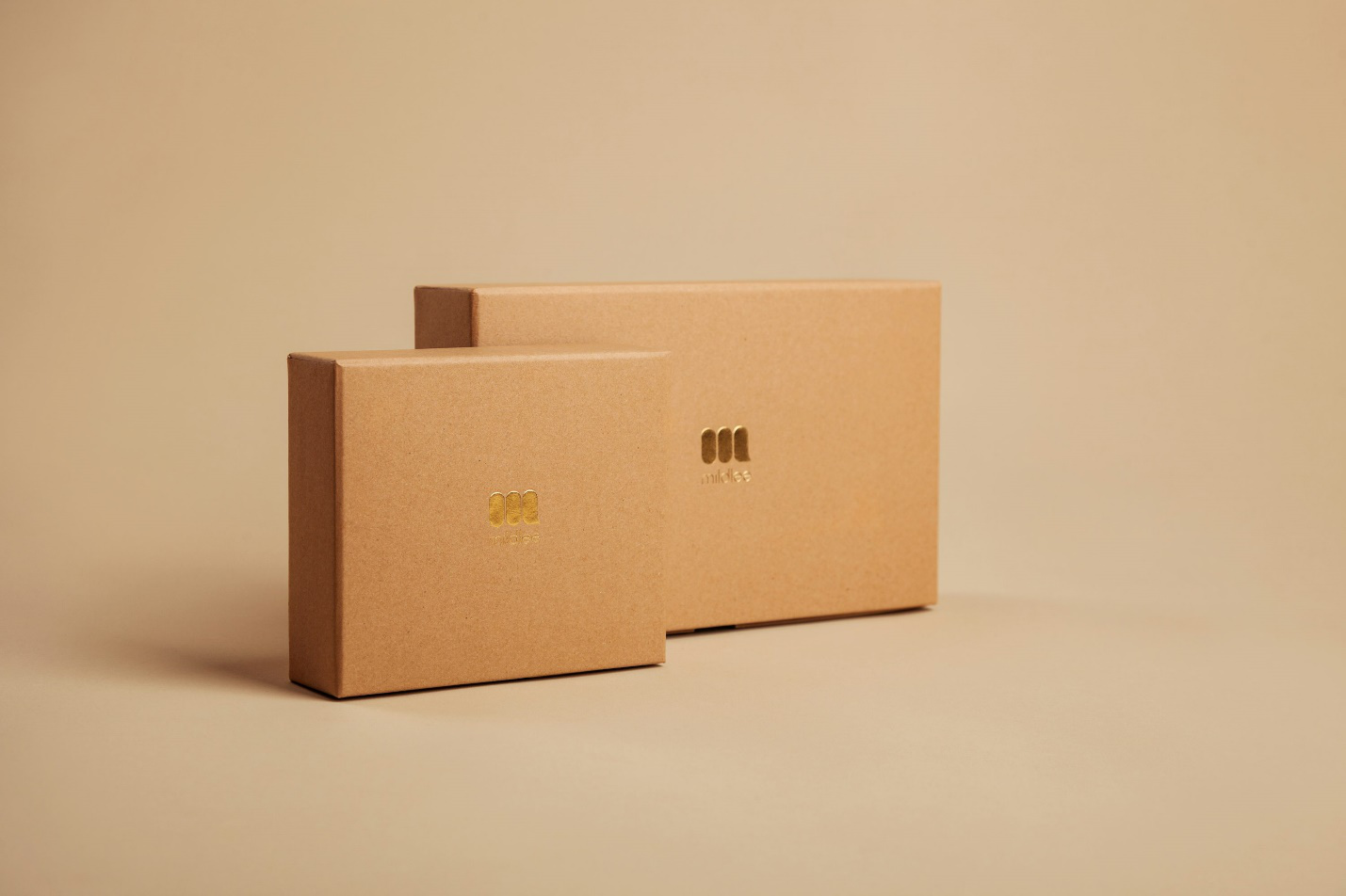 Two brown colored boxes standing side by side.